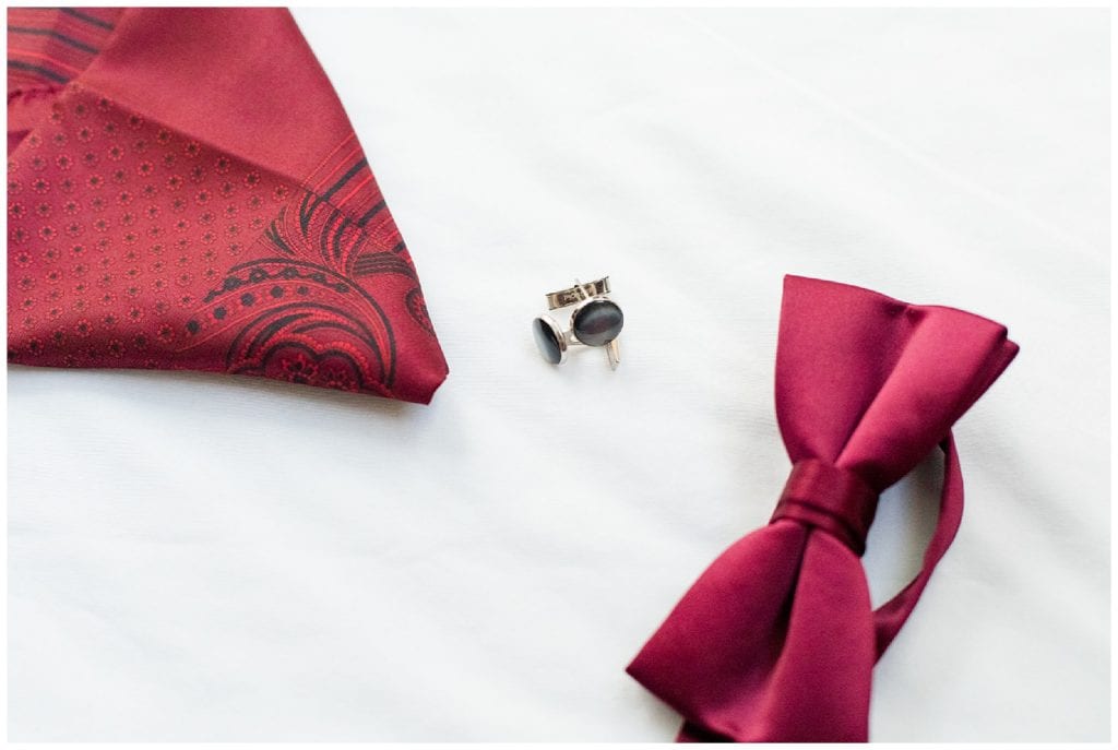 Groom's details red bow tie and red pocket square by Leidy & Josh photography.