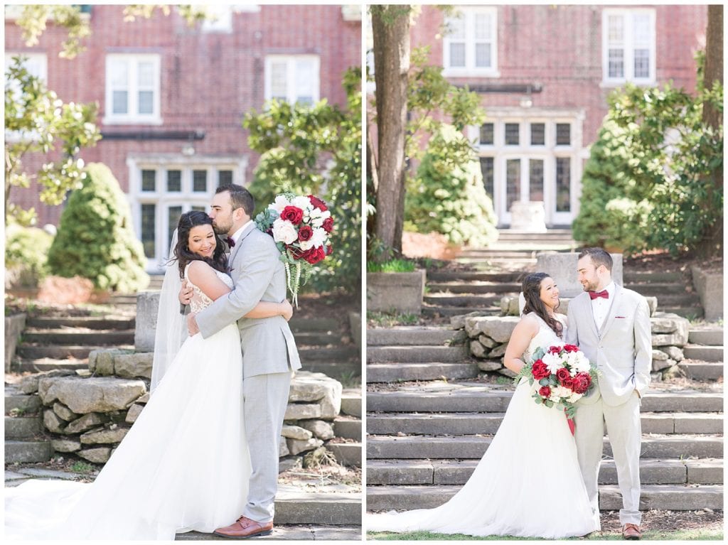 Bride and grooms standing in front of stone steps with a red brick building in the background.