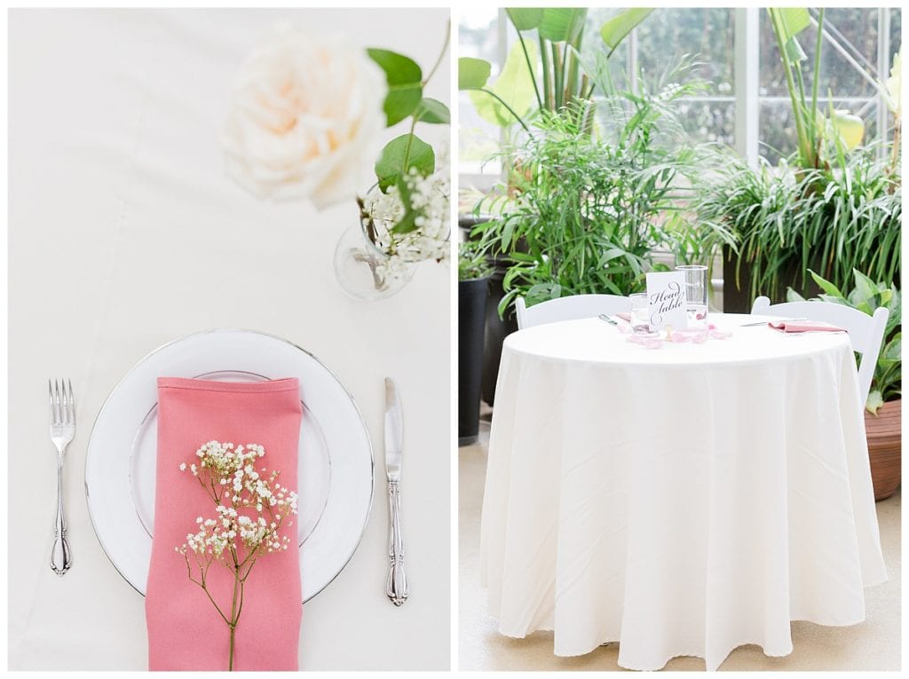 Head table setting with pink linens and white flowers in Greenhouse wedding at Downtown Market.