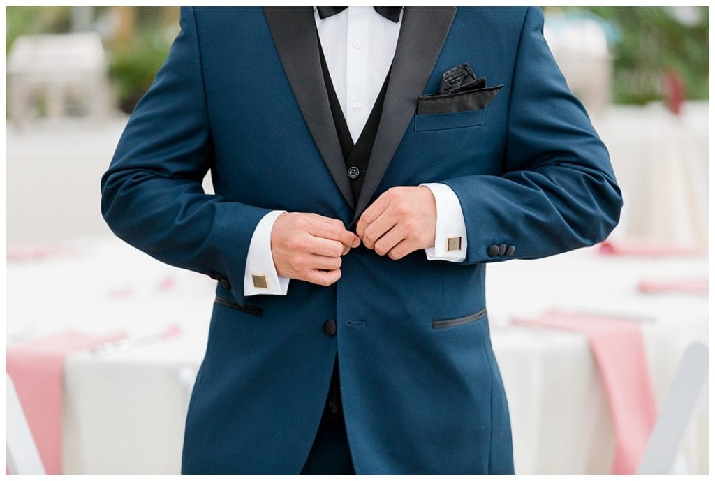Groom button jacket of blue tux at Downtown Market wedding.