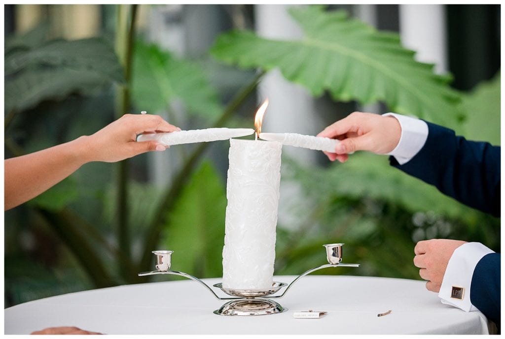 Unity candle during wedding ceremony during Grand Rapids Downtown Market wedding.
