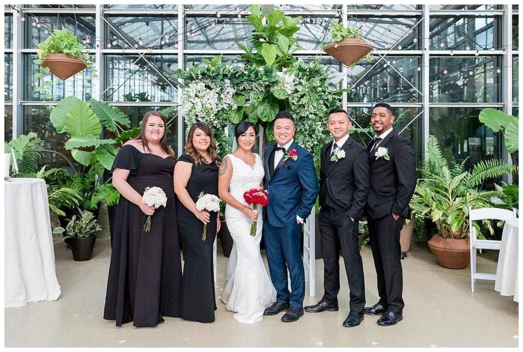 Bridal party in greenhouse at Downtown Market wedding.