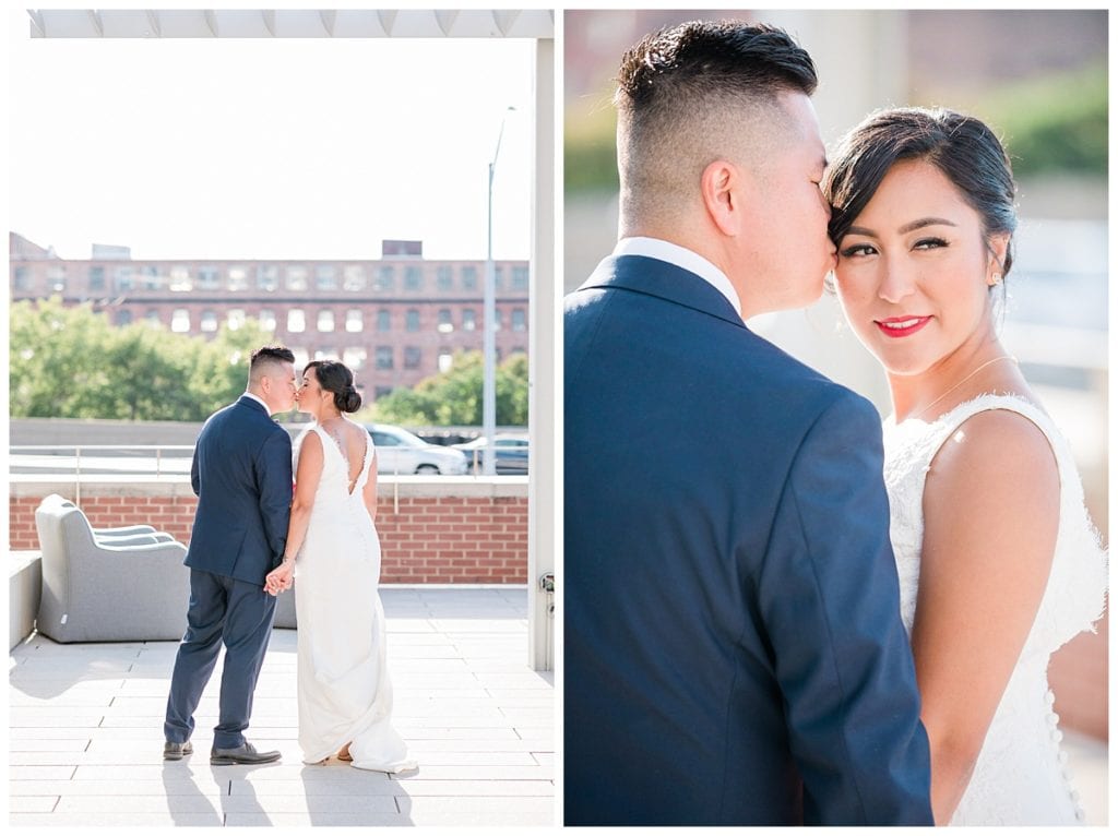 Bride and groom kissing and posing for wedding pictures at Downtown Market Grand Rapids.