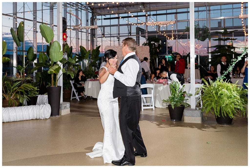 Bride dancing with her father in Greenhouse under the stars at Downtown Market Grand Rapids.